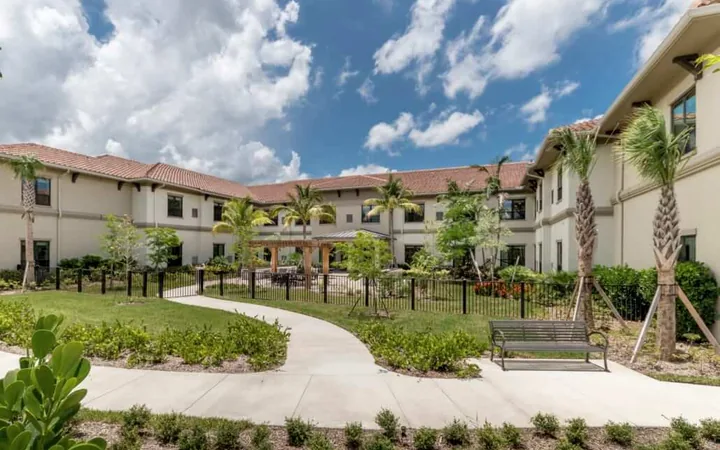 The courtyard and garden paths of Royal Palm Senior Living.