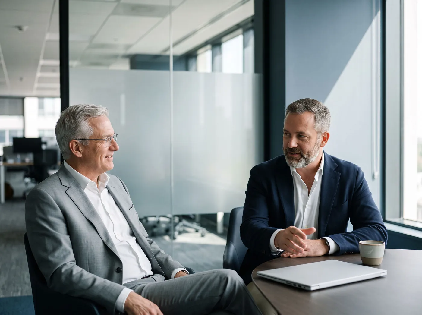A CPA firm partner and a Scarpello tax specialist in conversation at a conference table.